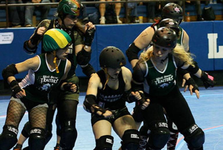 The Wall St. traitors put the hurt on someone.(Gotham Girls Roller Derby)