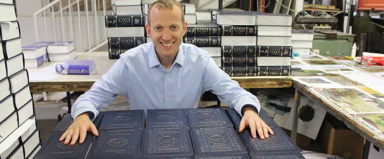 Editor Tuly Weisz at the Jerusalem publishing house in May as the first round of ‘The Israel Bible’ came off the press. The initial run of 1,500 copies sold out in the first month.