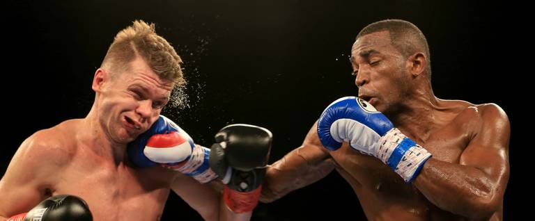Erislandy Lara (right) lands a punch against Yuri Foreman (left) during the third round of their WBA World Super Welterweight Championship bout at Hialeah Park in Miami, Florida, January 13, 2017. 