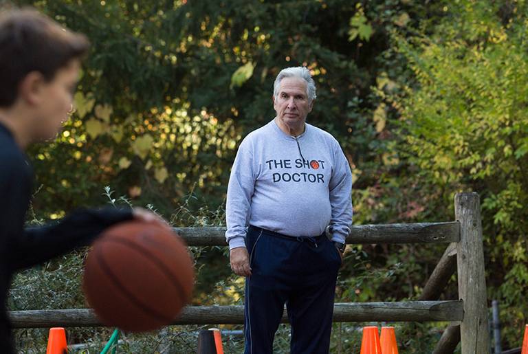Basketball coach John Goldman is pictured at his home in Chappaqua, N.Y., with Bryan Roden, an 11-year-old he is coaching, on Oct. 24, 2013.(Claudio Papapietro)