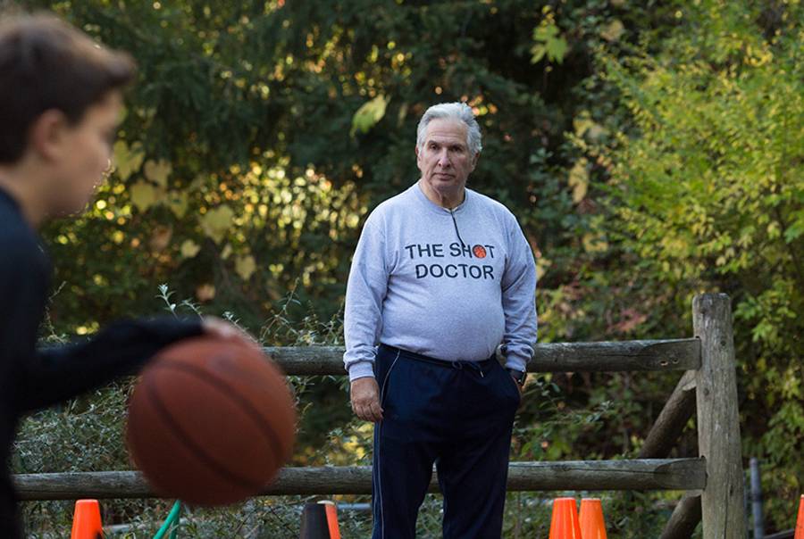 Basketball coach John Goldman is pictured at his home in Chappaqua, N.Y., with Bryan Roden, an 11-year-old he is coaching, on Oct. 24, 2013.(Claudio Papapietro)