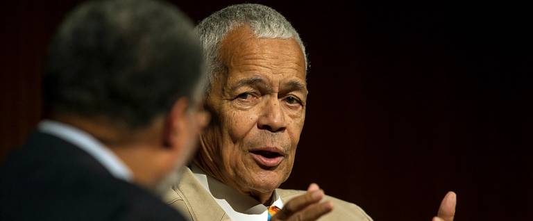 Julian Bond, former Chairman, NAACP (R) looks over towards Lonnie G. Bunch, III, moderator, during the panel discussion, 'Heroes of the Civil Rights Movement: Views from the Front Line,' on the second day of the Civil Rights Summit at the LBJ Presidential Library in Austin, Texas, April 9, 2014.  