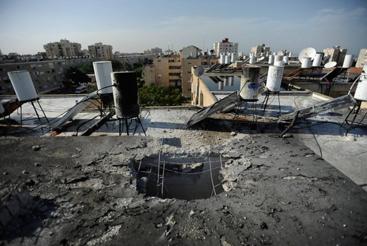 Damage caused to a building by a rocket launched by Palestinian militants from Gaza strip hitting the city of Ashkelon on November 18, 2012.(DAVID BUIMOVITCH/AFP/Getty Images)