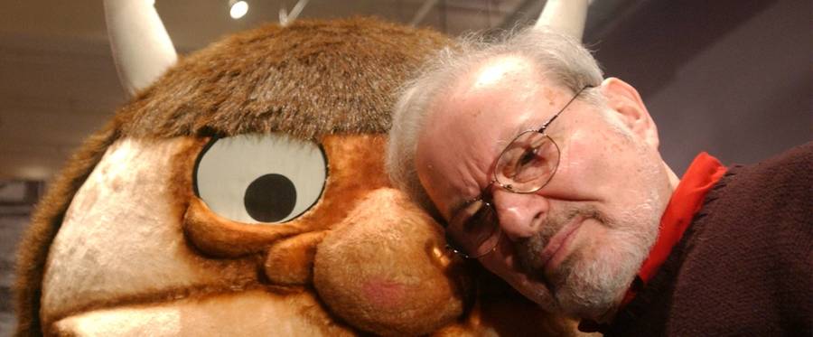 Standing with a character from his book 'Where the Wild Things Are,' author and illustrator Maurice Sendak speaks with the media before the opening of an exhibition entitled, 'Maurice Sendak In His Own Words and Pictures,' at the Childrens Museum of Manhattan in New York City,  January 11, 2002. 