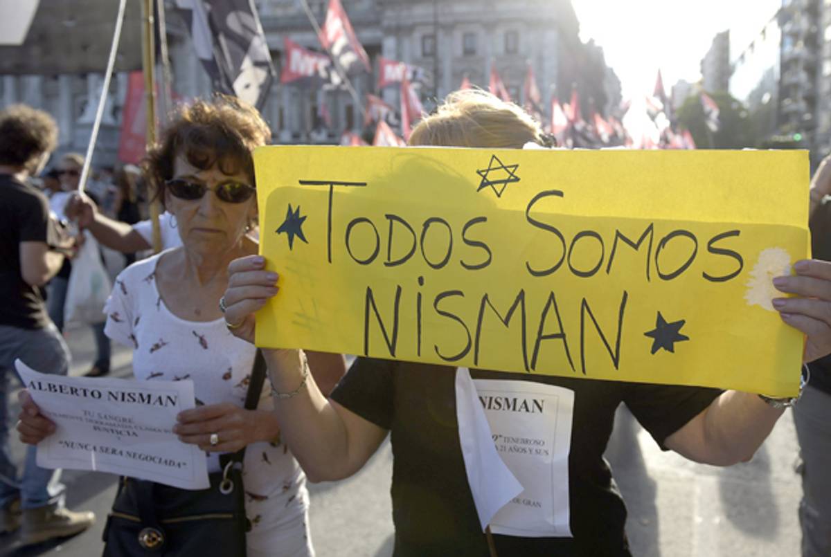 A woman holding a placard that reads 'We are all Nisman' near Argentina's Congress during a February 4, 2015 demonstration in Buenos Aires following the death of Argentine prosecutor Alberto Nisman. ( JUAN MABROMATA/AFP/Getty Images)