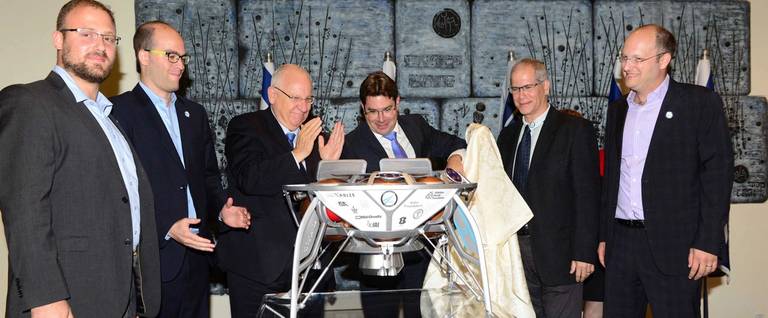Unveiling the spacecraft in SpaceIL's launch announcement ceremony, at President Rivlin's residence. L-R: Yariv Bash, Eran Privman, Minister Ofir Akunis, President Reuven Rivlin, Yonatan Winetraub, Kfir Damari.
