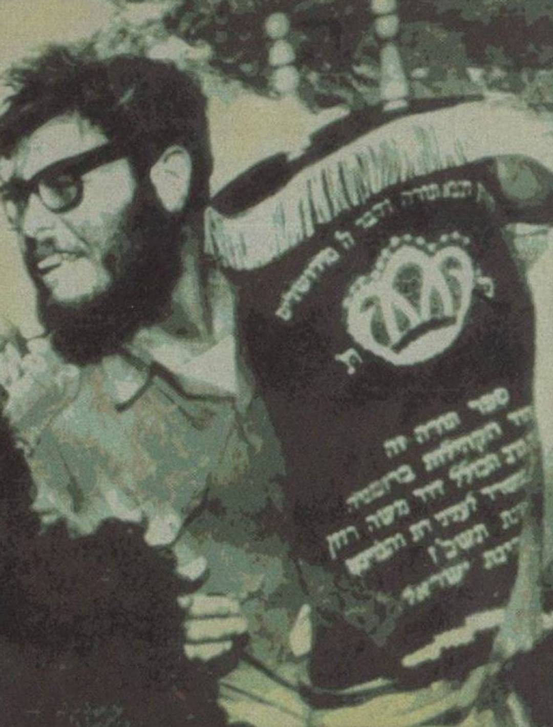 Hillel Unsdorfer carries a Torah on his way to Egyptian captivity along with his unit, 1973. About his decision, he said, ‘Most of us felt we should take the Torah with us to Egypt because it watched over us while we were fighting. We felt it should stay with us and continue to guard us.’