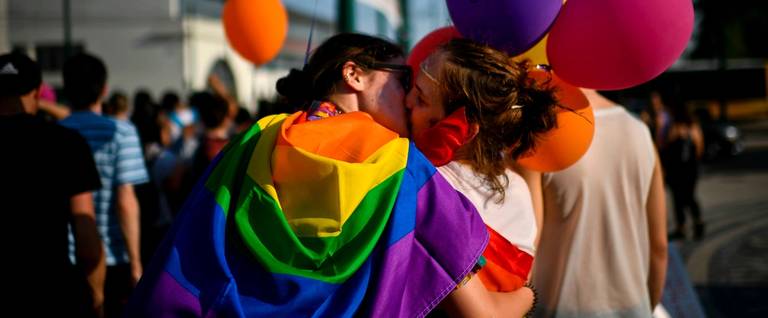 A couple kisses during the gay pride parade in Lisbon, Portugal, June 17, 2017.