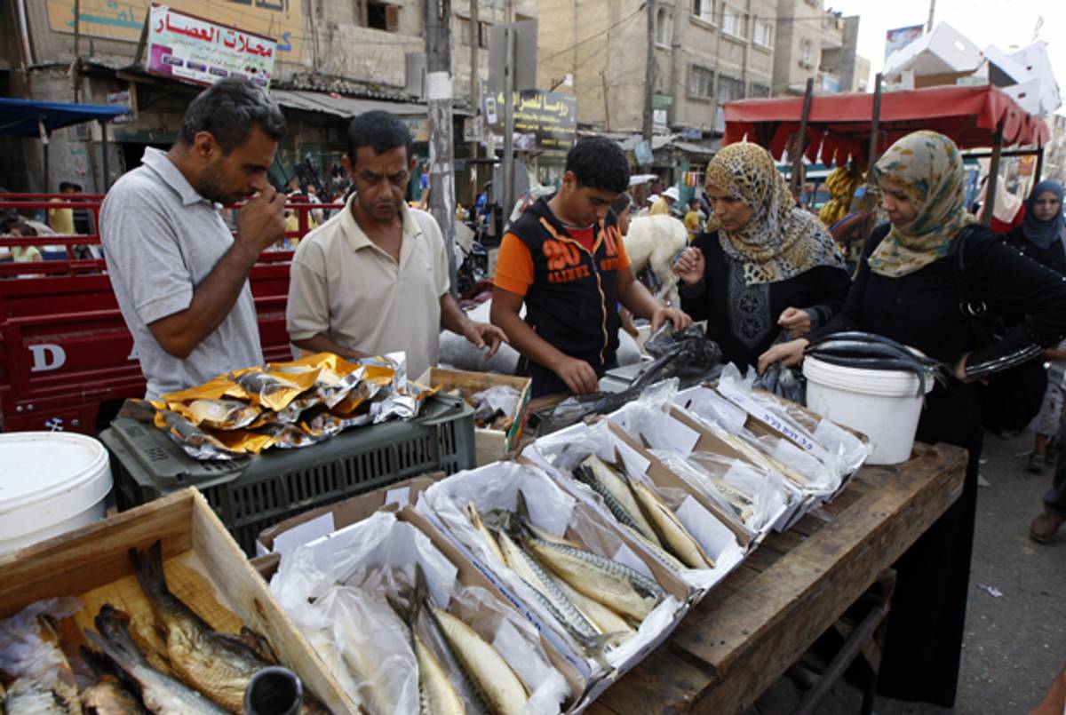 Palestinian women at a Gaza fish market this summer.(Said Khatib/AFP/Getty Images)