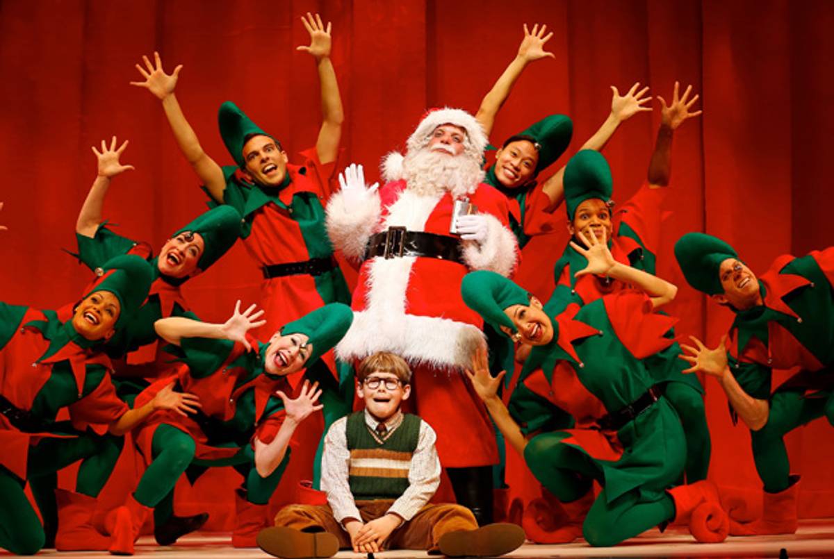 Eddie Korbich (standing center), Johnny Rabe (seated center), and company in A Christmas Story, The Musical.(Carol Rosegg)