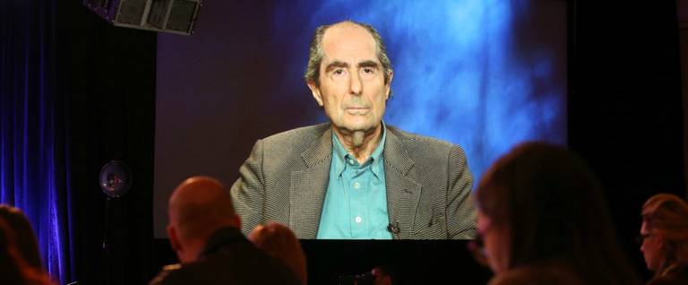 An image of author Philip Roth is projected onscreen as he speaks via satellite video feed to the audience during the PBS panel of 'American Masters, Philip Roth: Unmasked' at the 2013 Winter Television Critics Association Press Tour at the Langham Huntington on Jan, 14, 2013, in Pasadena, California.