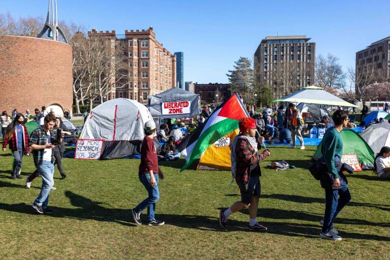 Students from Massachusetts Institute of Technology, Harvard University, and others rally at a protest encampment by the Scientists Against Genocide on MIT's Kresge Lawn in Cambridge, Massachusetts, on April 22, 2024