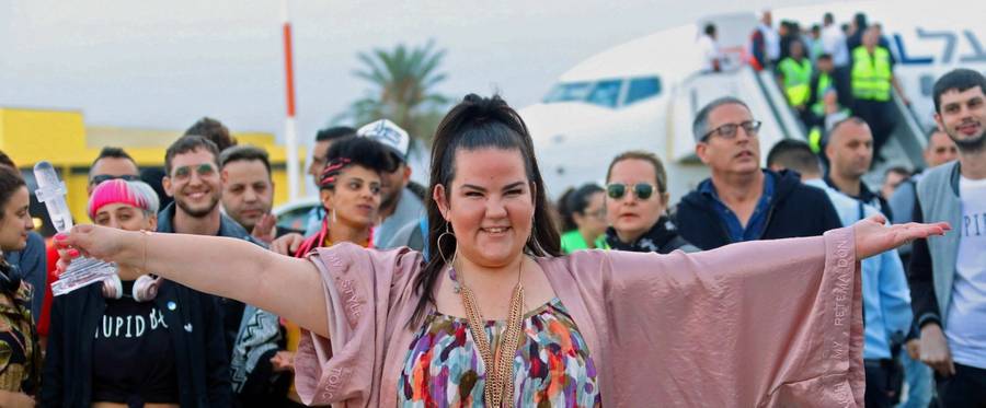 Israel's Netta Barzilai poses for a photograph as she arrives at Ben Gurion Airport near Tel Aviv on May 14, 2018 after winning the Eurovision Song Contest on May 13 in Lisbon.