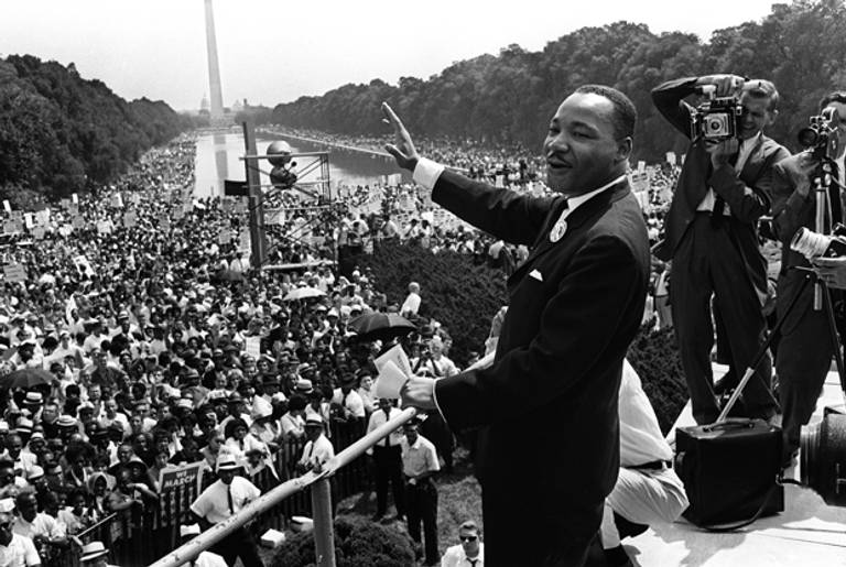 The civil rights leader Martin Luther KIng (C) waves to supporters 28 August 1963 on the Mall in Washington DC during the 'March on Washington'. (AFP/Getty Images)