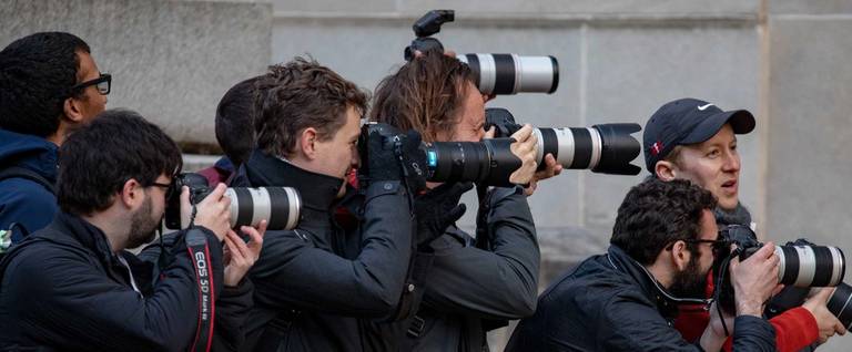 Photographers try to get a view at the the Department of Justice on March 22, 2019 in Washington, DC.
