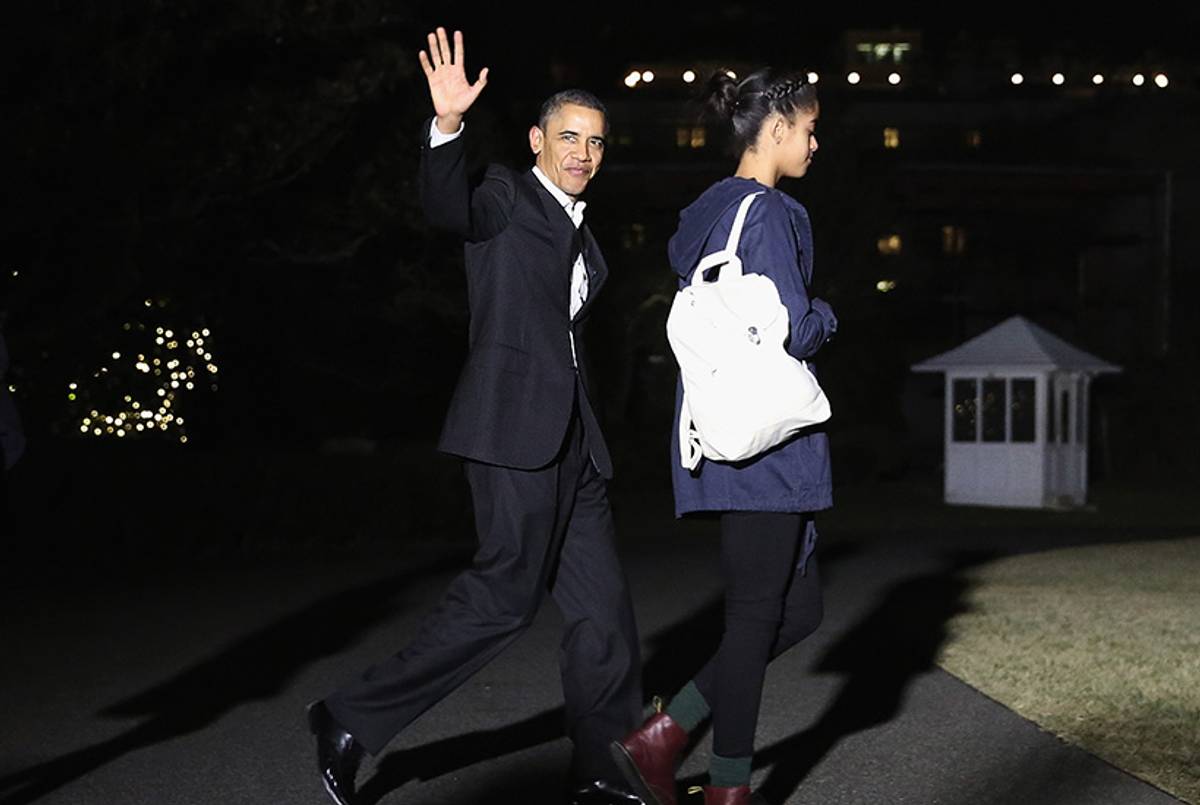 President Barack Obama waves as he walks toward Marine One with daughter Malia December 20, 2013, in Washington, D.C.(Alex Wong/Getty Images)