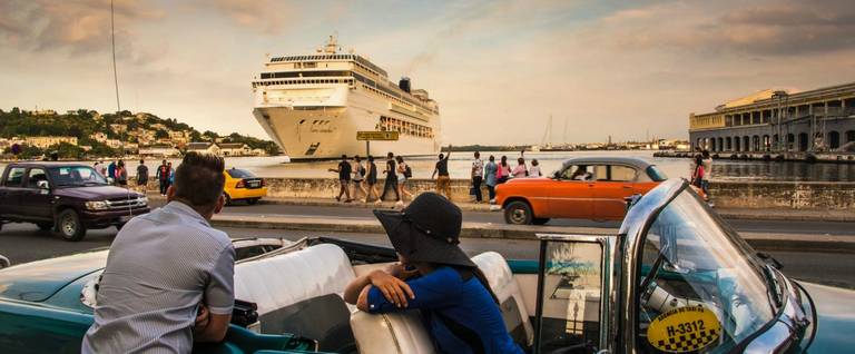 Cubans observe the arrival of a cruise ship bringing tourists to Havana, January 18, 2017.
