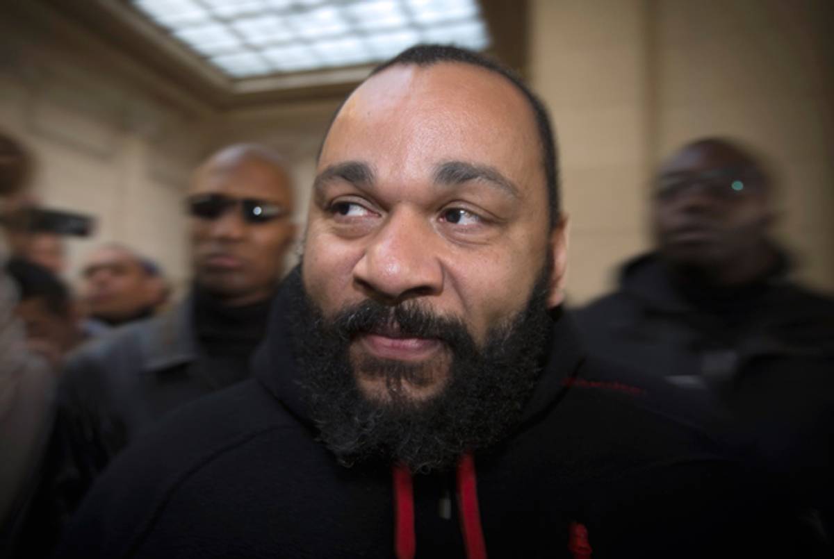 Dieudonne Mbala Mbala arrives for a trial at the Paris courthouse on December 13, 2013 on the charges of defamation, insults, incentive to hate and discrimination. (JOEL SAGET/AFP/Getty Images)