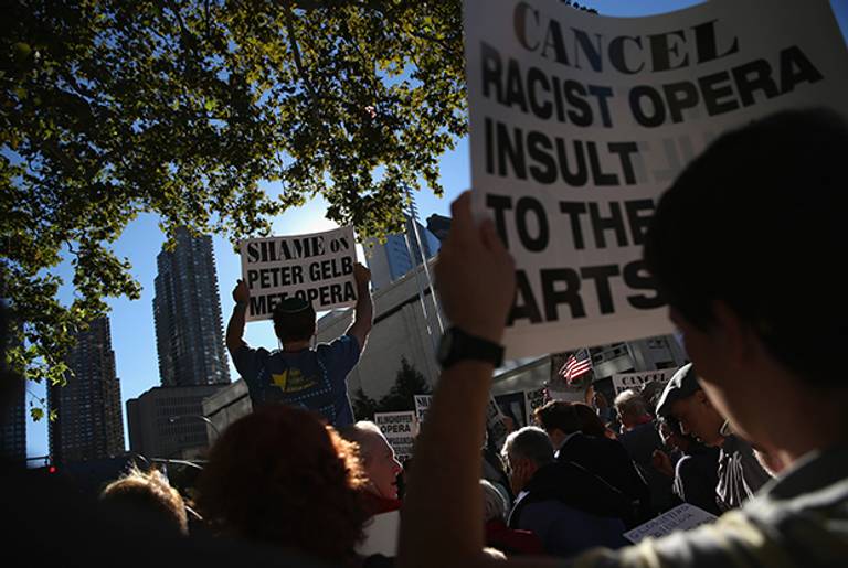 Protesters demonstrate as people arrive for the opening night of the Metropolitan Opera season at Lincoln Center on September 22, 2014 in New York City. (John Moore/Getty Images)