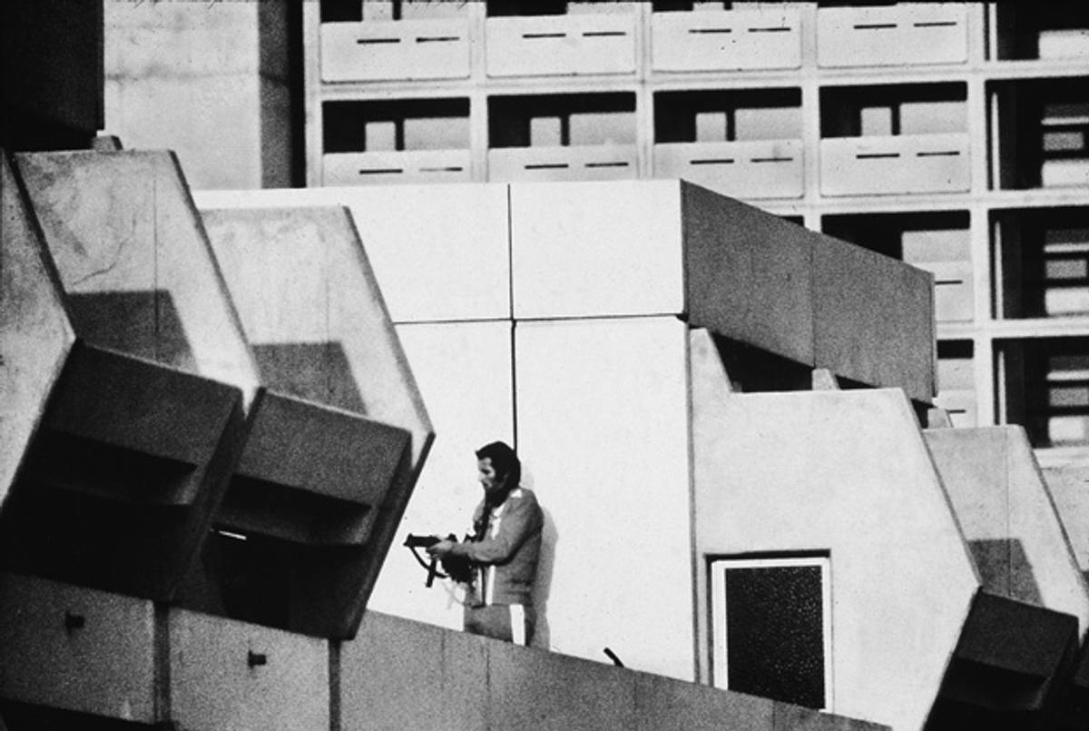 A German policeman on the roof of a dormitory where members of the Black September terrorist group were holding a group of Israeli athletes hostage, Munich, Germany, Sept. 5, 1972.(Hulton Archive/Getty Images)