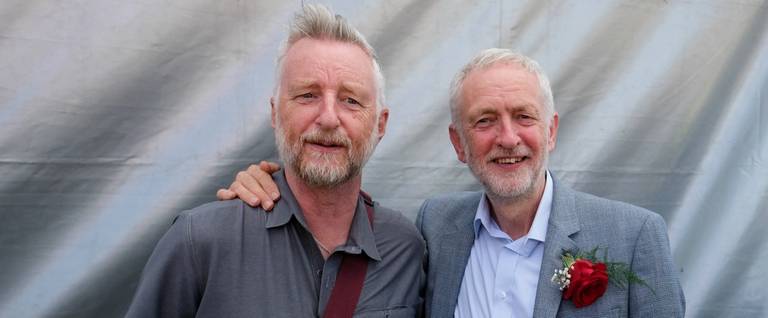 Labour leader Jeremy Corbyn poses with singer Billy Bragg during the 134th Durham Miners’ Gala on July 14, 2018, in Durham, England.