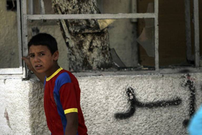 Outside the shattered courthouse of a Damascus suburb.(Joseph Eid/AFP/Getty Images)