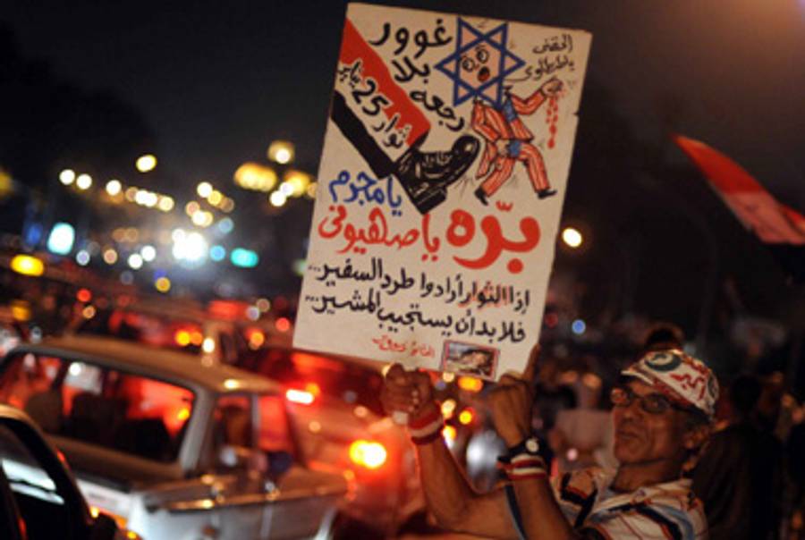 A protester outside the Israeli Embassy in Cairo.(-/AFP/Getty Images)