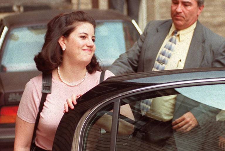 Former White House intern Monica Lewinsky gets leaves the offices of her attorney William Ginsburg in Washington, DC on April 1, 1998. (JOYCE NALTCHAYAN/AFP/Getty Images)
