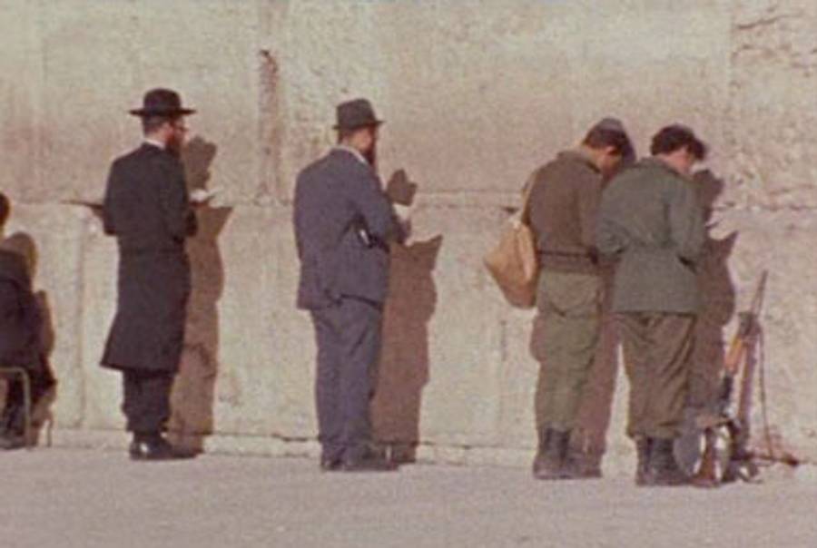 Civilians and soldiers at the Western Wall in Promised Lands.(Courtesy Light Industry)
