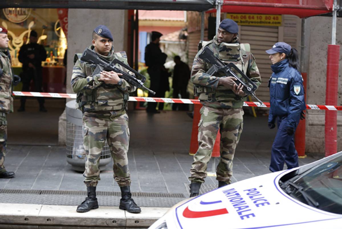 Soldiers and Security Police Forces stand guard outside the Jewish Community Center where three soldiers patrolling the center were attacked by a man with a bladed weapon on February 3, 2015 in Nice, France. (VALERY HACHE/AFP/Getty Images)