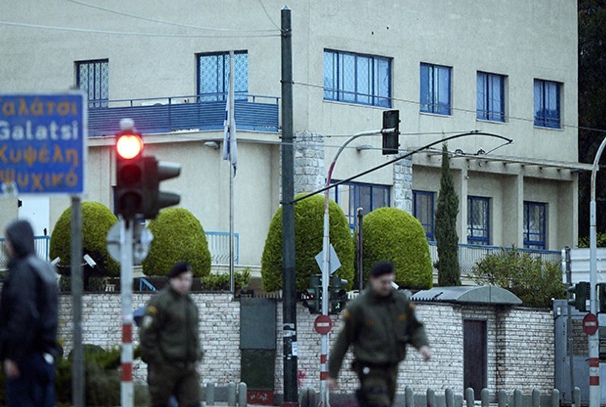 Police investigate after a shooting at the Israeli embassy in Athens, Greece on December 12, 2014. (LOUISA GOULIAMAKI/AFP/Getty Images)