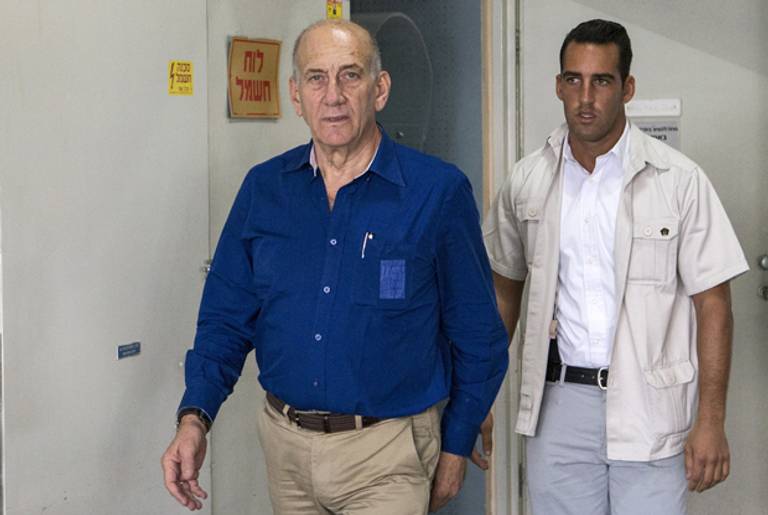 Former Israeli Prime Minister Ehud Olmert arrives at the district court of Tel Aviv on May 13, 2014. (JACK GUEZ/AFP/Getty Images)