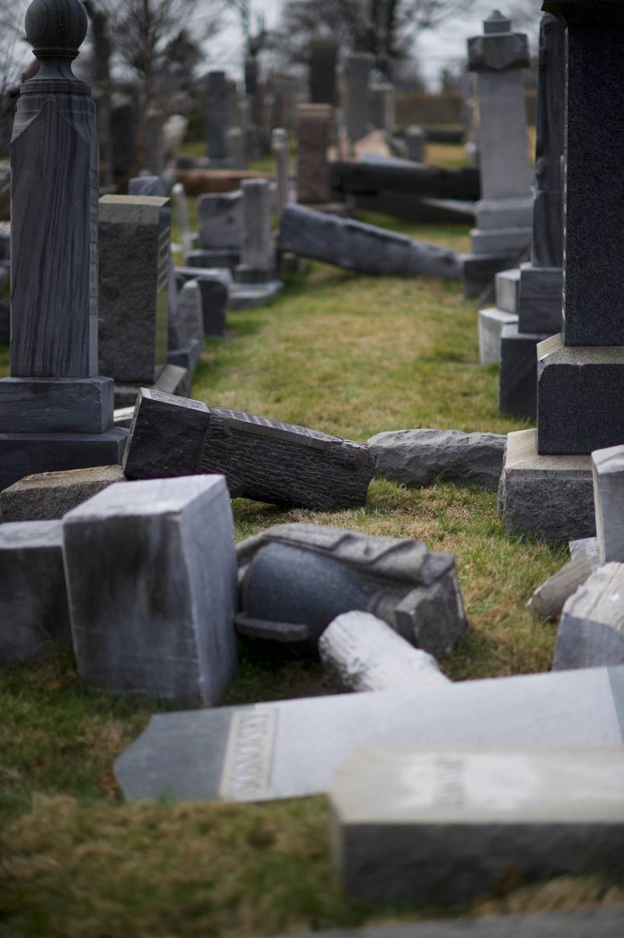 Jewish tombstones lay vandalized at Mount Carmel Cemetery in Philadelphia, Feb. 27, 2017