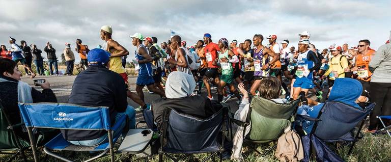 People cheer runners along during the 56-mile Comrades Marathon between Pietermaritzburg and Durban on June 10, 2018. The annual ultramarathon this year attracted over 20,000 runners from around the world.