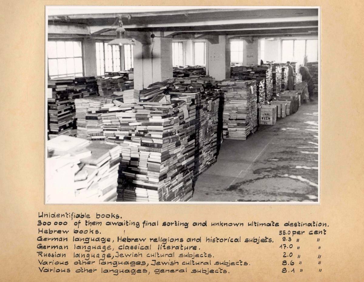 Piles of unidentified books in the Offenbach Archival Depot warehouse, Offenbach, Germany, 1946
