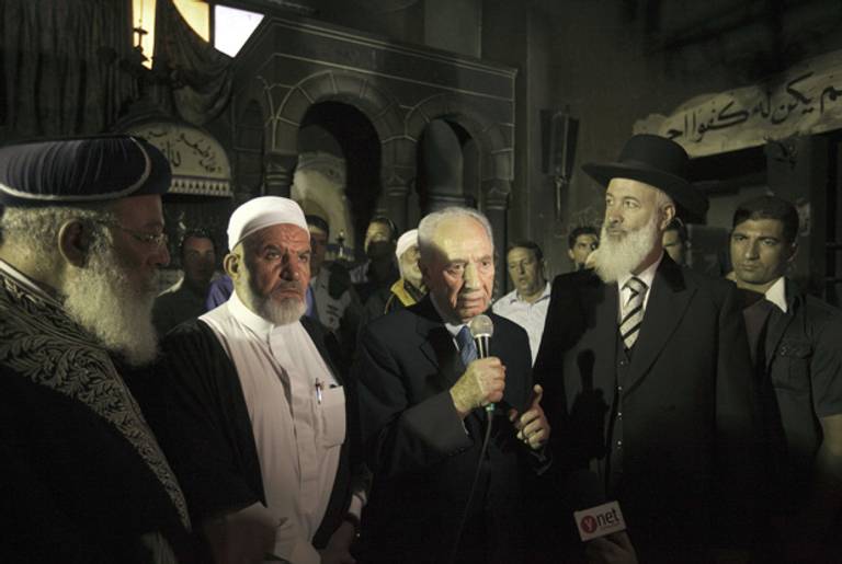 President Peres, flanked by chief rabbis and a sheikh, speaking at the mosque today.(Menahem Kahana/AFP/Getty Images/)