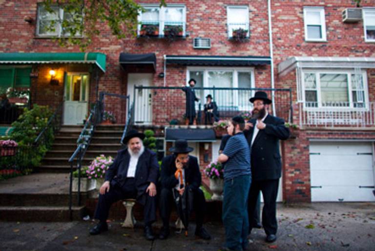 Hasidic men in Borough Park awaiting the chance to mourn Kletzky.(Ramin Talaie/Getty Images)