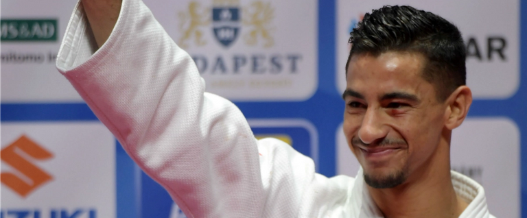 Bronze medalist of the mens -66kg category Israel's Tal Flicker celebrates on the podium during the medal ceremony at the World Judo Championships in Budapest on August 29, 2017.