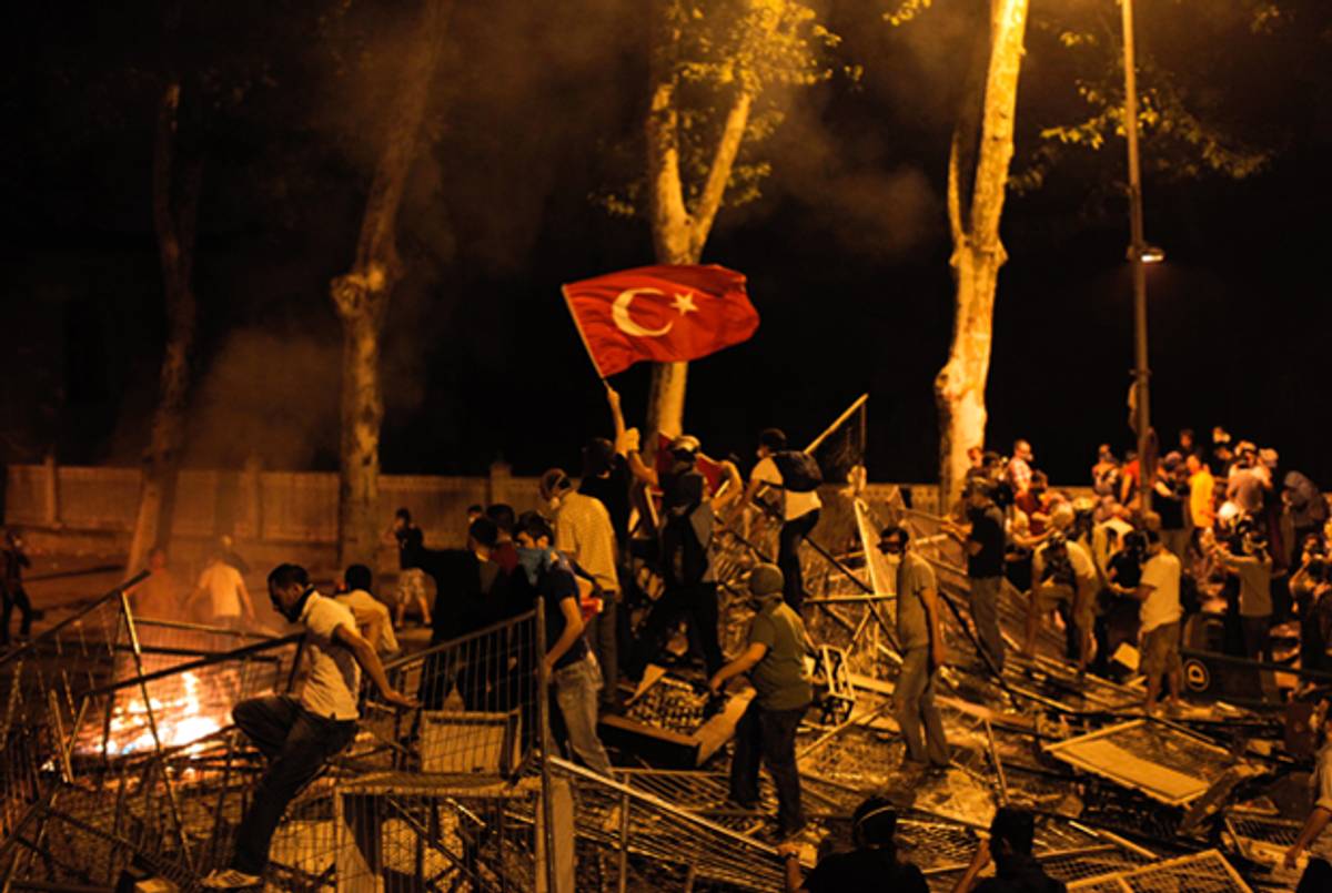 Protestors clash with riot police between Taksim and Besiktas in Istanbul, on June 1, 2013, during a demonstration against the demolition of the park.(GURCAN OZTURK/AFP/Getty Images)