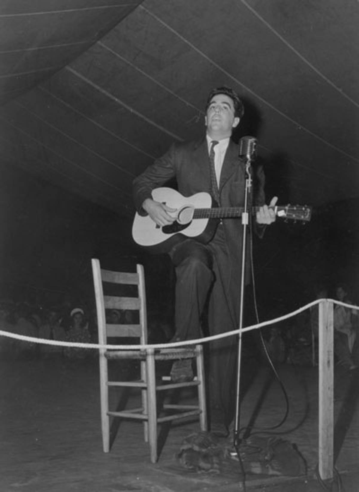 Alan Lomax playing guitar on stage at the Mountain Music Festival, Asheville, North Carolina, 1938-1950 (Alan Lomax Collection, Library of Congress)