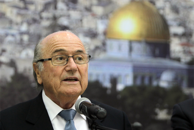 FIFA President Sepp Blatter speaks as President of the Palestinian Football Federation Jibril Rajoub (unseen) listens on in Ramallah on July 7, 2013. (Abbas Momani/AFP/Getty Images)