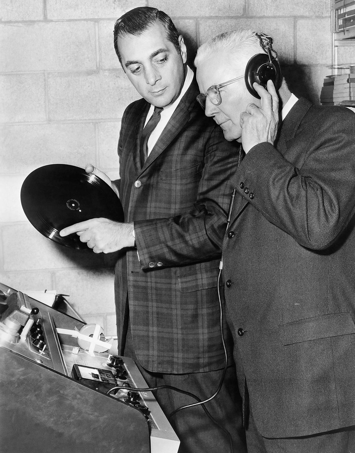 Henry G. Saperstein, at left, and Dick Tracy creator Chester Gould listening to the soundtrack of the 'Dick Tracy Show,' 1961