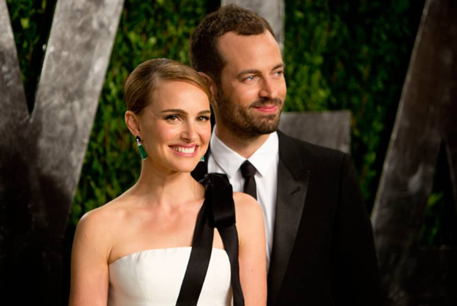 Natalie Portman and Benjamin Millipied (R) arrive for the 2013 Vanity Fair Oscar Party on February 24, 2013 in Hollywood, California following the 85th Academy Awards ceremony. (ADRIAN SANCHEZ-GONZALEZ/AFP/Getty Images)