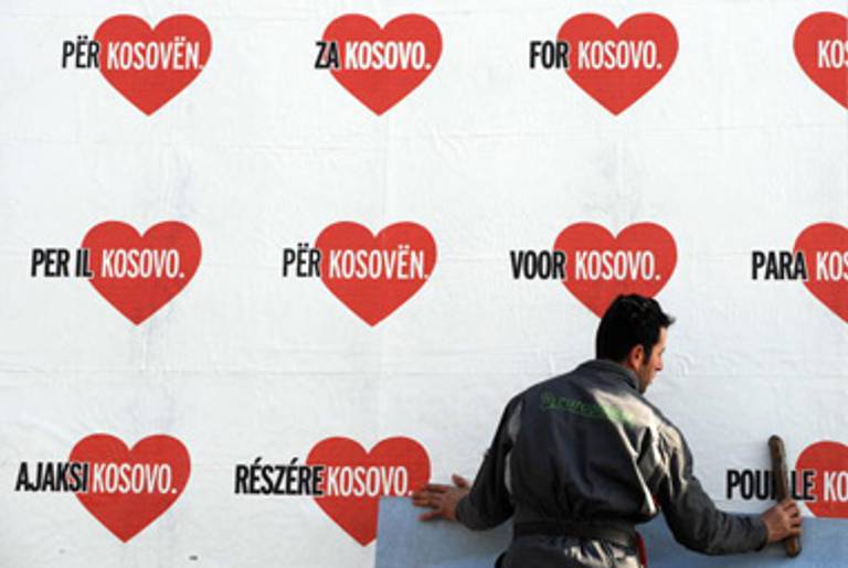 Hanging posters in Pristina, Kosovo’s capital, in the days before the declaration of statehood.(Dimitar Dilkoff/AFP/Getty Images)