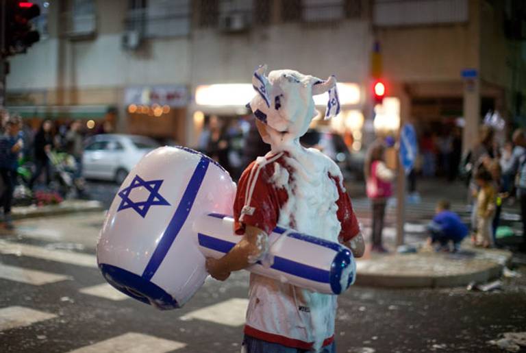 Israel Independence Day celebrations on the streets of Tel Aviv last night.(Uriel Sinai/Getty Images)
