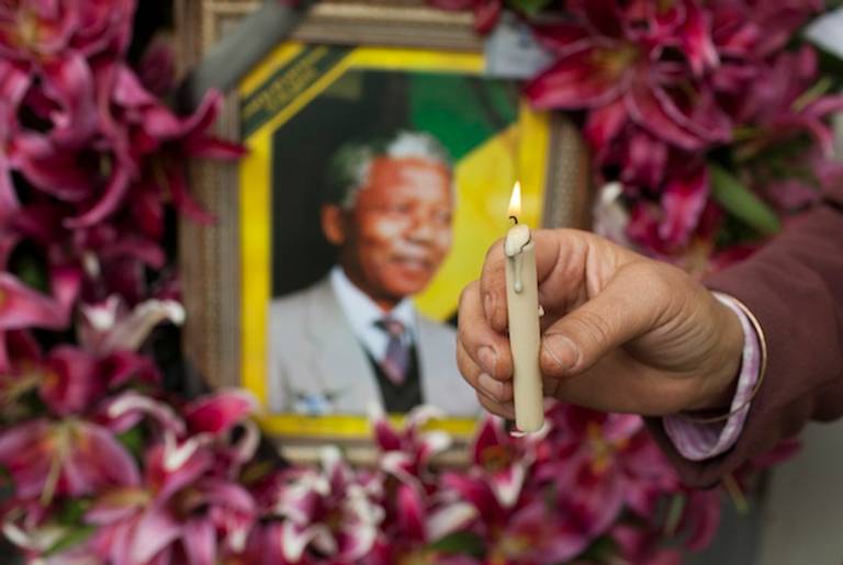 Mourners gathered in front of the South African embassy to pay their respects to the memory of Nelson Mandela on December 7, 2013 in Tehran, Iran.(Getty)