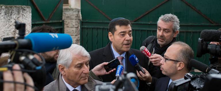 Marseille's Jewish Consistory president Zvi Ammar (C) speaks to journalists in front of the 'La Source' Jewish school in Marseille, France, January 11, 2016. 