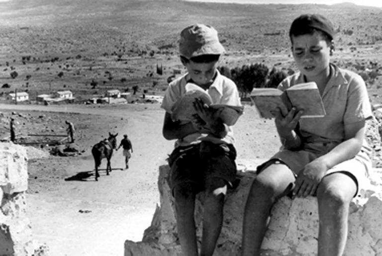 Two boys from San Nicandro reading the Bible in Meiron, Israel, in the 1950s.(Courtesy Beit Hatfutsot Photo Archive, Sonnenfeld collection)
