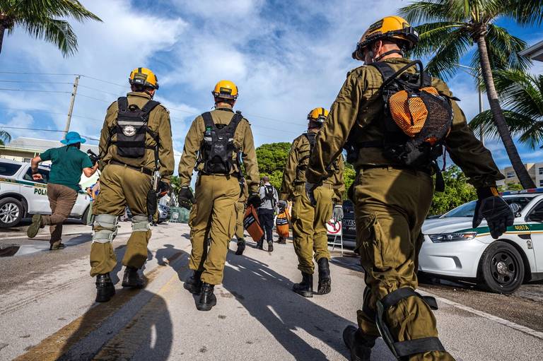 Members of the Israel Rescuers delegation gather upon their arrival in the area near the partially collapsed 12-story Champlain Towers South condo building in the city of Surfside, Florida, on June 27, 2021.