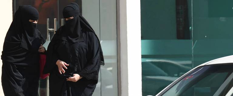 Saudi women leave mall in Riyadh before taking taxi as elsewhere a grassroots campaign planned to call for an end to the driving ban for women in Saudi Arabia on October 26, 2014. Amnesty International is calling on the Saudi Arabian authorities to respect the right of women to defy the ban by driving this weekend and to end the harassment of supporters of the campaign.
